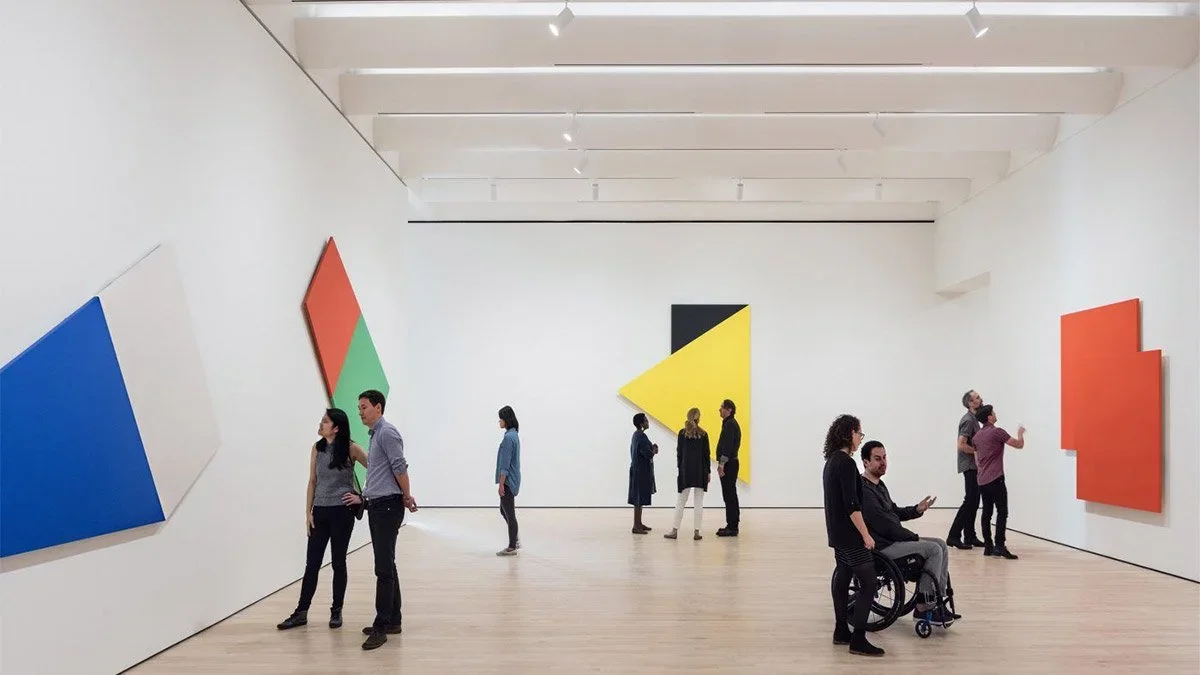 people standing around the gallery at the san francisco museum of modern art